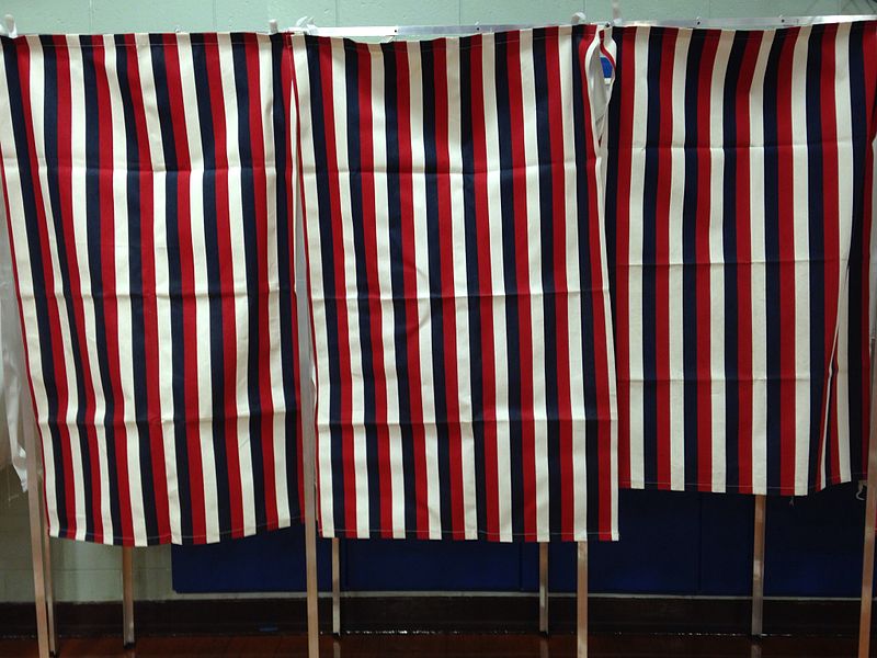 Voting booths in New Hampshire. Photo courtesy of https://commons.wikimedia.org