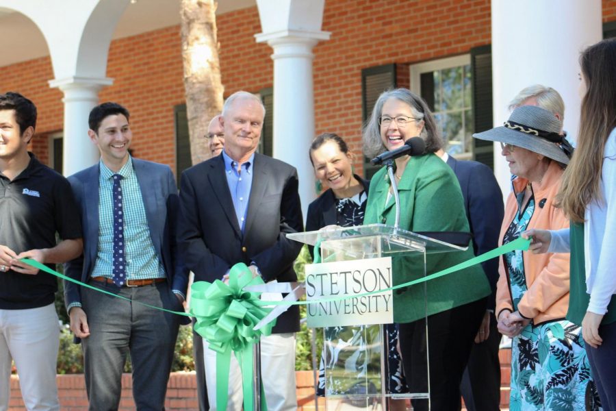 President Wendy Libby cuts the ribbon during the ceremony announcing the completed Carlton-Union Building.