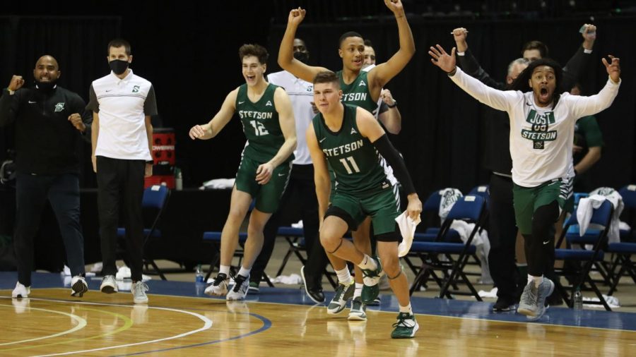 Freshman Chase Johnston and the Hatter bench celebrate after an opening round win in the 2021 CBI. Courtesy of Stetson Athletics.