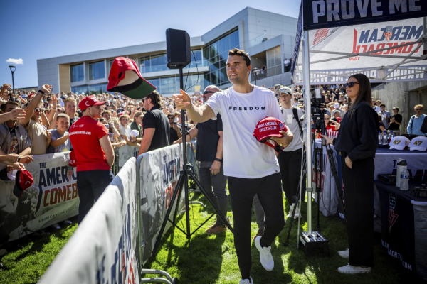 Charlie Kirk distributes ‘MAGA’ hats to the public before speaking at Utah Valley University in Orem, Utah, Wednesday, Sept. 10, 2025. Photo credit: Tess Crowley/The Deseret News via AP